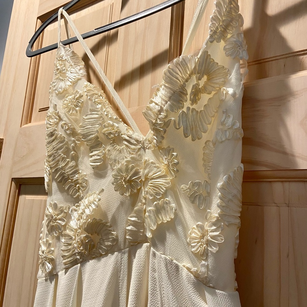 Beautiful Ivory Jumper with train like material